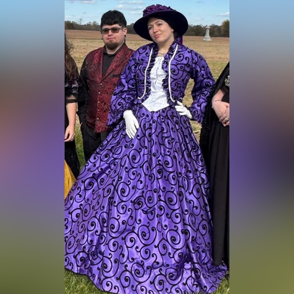 Purple dress w/ hat/corset/hoop skirt included. I’m a size 32 waist/36C for ref